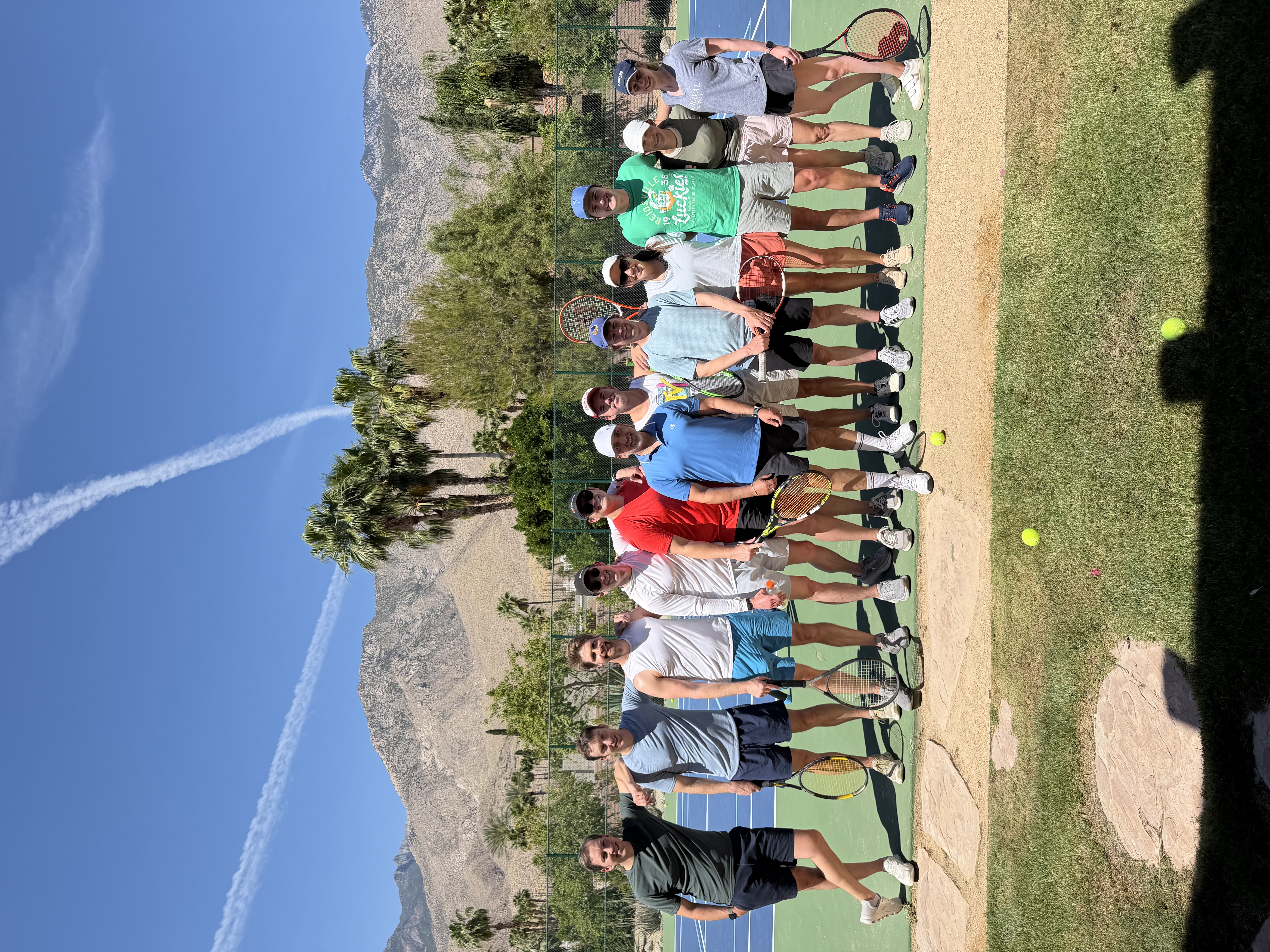 Coach Brian Guzman leading a group tennis clinic, Coachella Valley